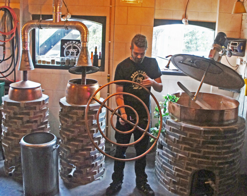 Colin Hoeffnagel with the original equipment at the De Molen brewery, two tiny coppers and a combined mash tun/fermenting vessel