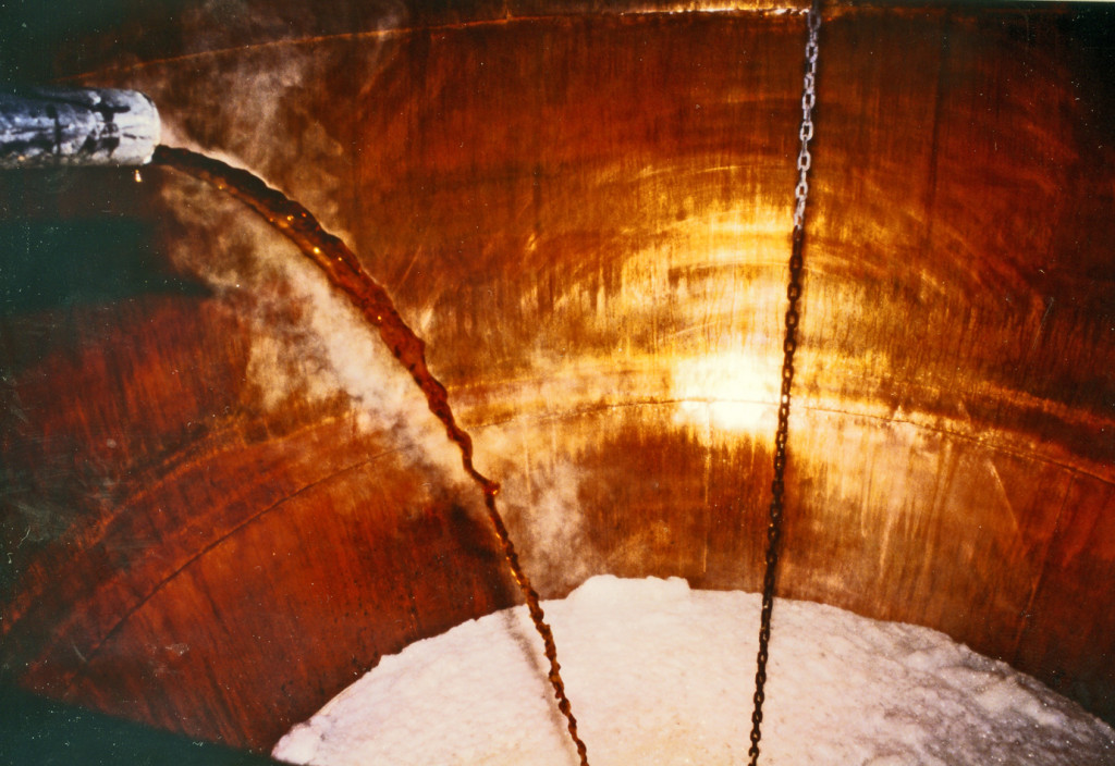 Steaming wort runs into an open copper at the Caledonian brewerry, Edinburgh, in 1989