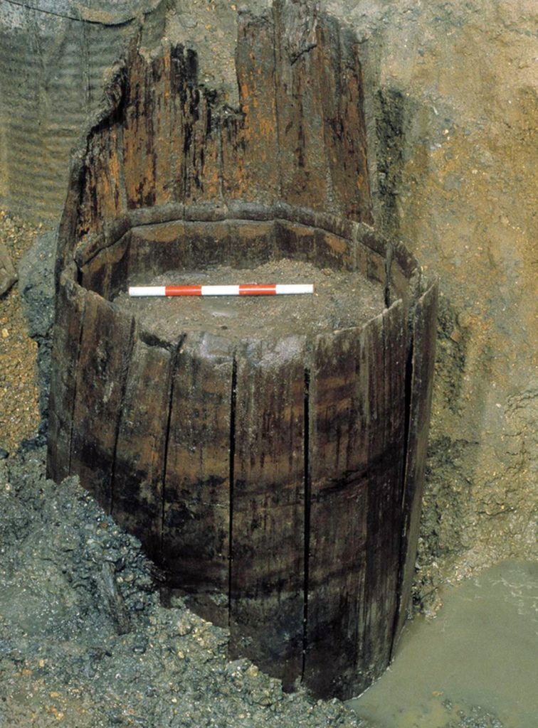 A Roman cask with its head-boards removed, used as a well-lining circa AD65-95, found on the 1 Poultry side in the City of London, just to the north of the Bloomberg site. The cask, made of fir wood, is almost two metres tall and would have contained around 200 gallons, rprobably of wine. Similar casks were also recycled into writing gtablets.